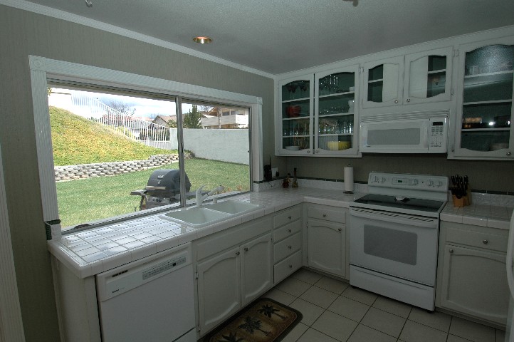 Spacious Kitchen with view of entire safe fenced yard