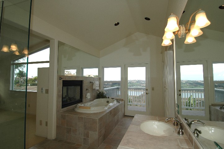 Peeking through the corner of the shower... you can see the wall of windows...