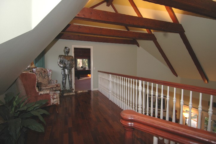 Here from the loft above... the Hand Hewn Beamed Ceiling can be appreciated....