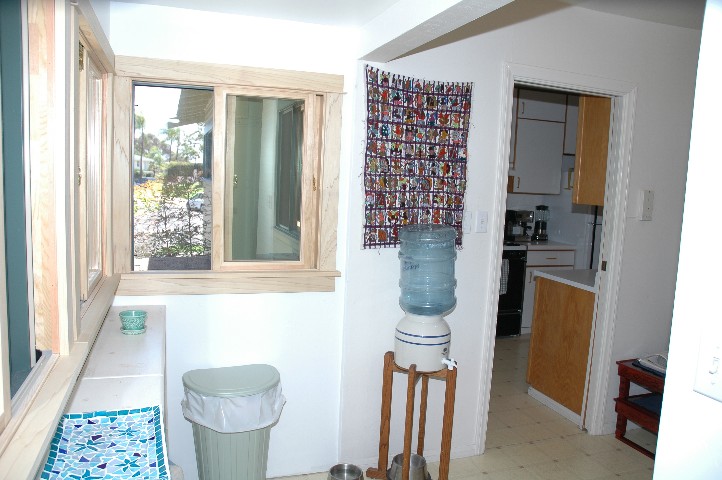 Wonderful Mud Room enclosed back porch... picture the window frames stained and finished.